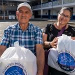 Rostros felices de nuestros beneficiados en el evento.